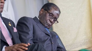 Zimbabwe’s ruling party fires warning shots at Mugabe