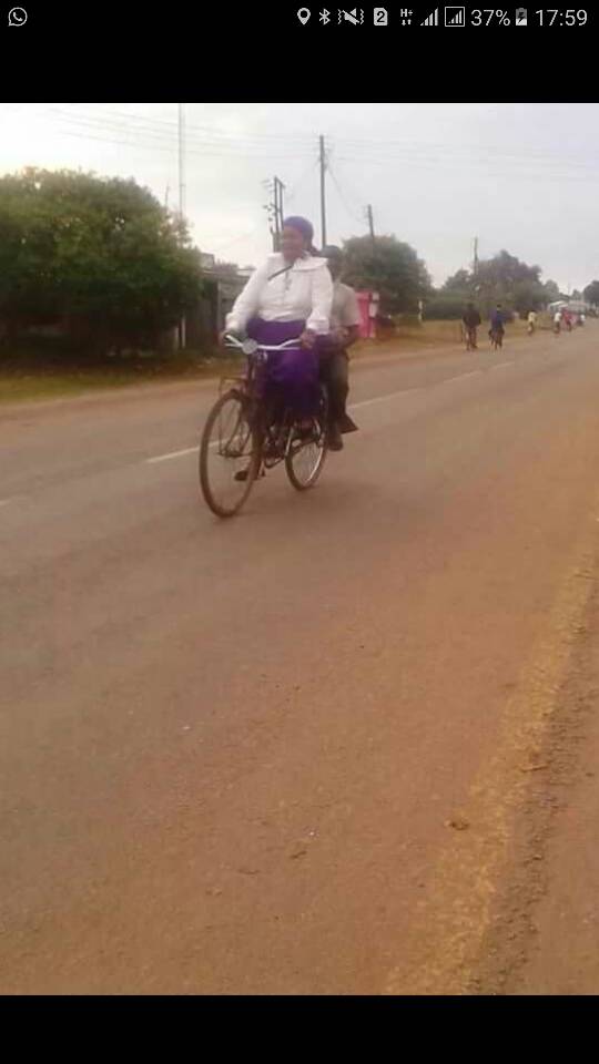 Malawi’s Good Friday; “Akweni” Patricia Kaliati peddles bicycle taxi from “The Way of Cross”