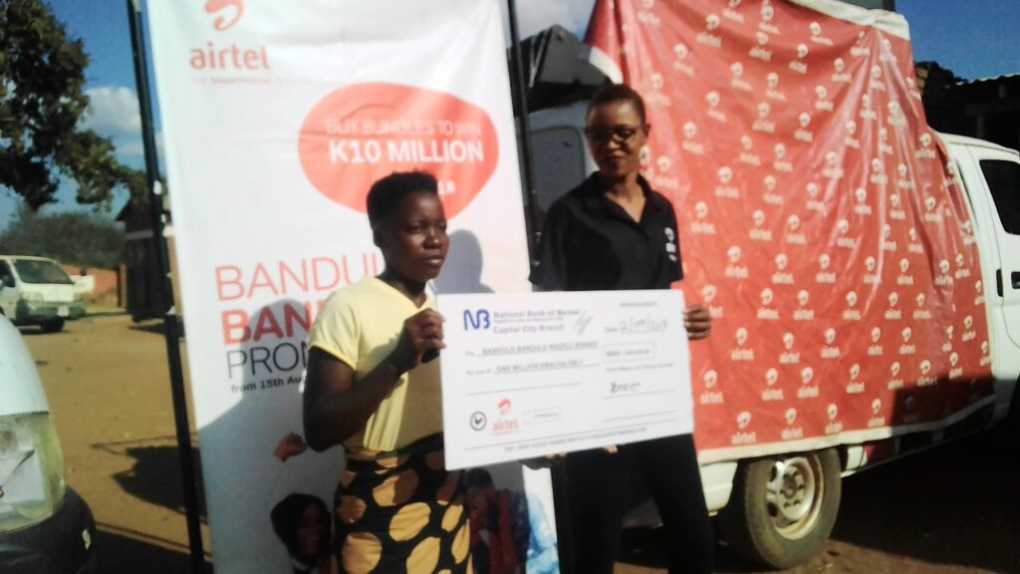 Is it ladies Airtel “Bandaulo Bandulo” promotion? Kasungu school girl Sherifa smiles with MK1m