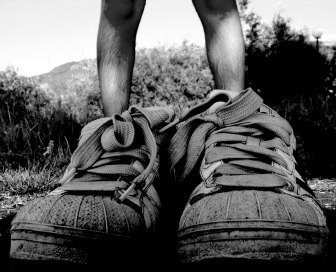 Chimulilenji is wearing oversized shoes