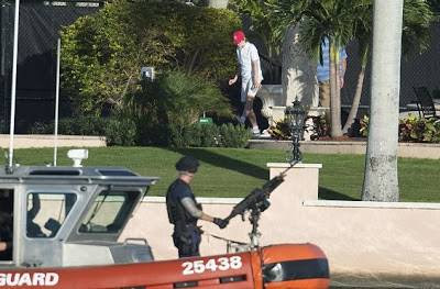 US President Donald Trump’s son Barron surrounded by heavily armed guards as he goes to play