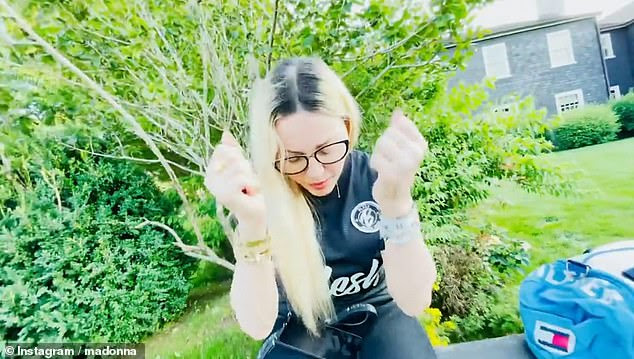 US pop star Madonna cheers up son David Banda’s goal scores during heartwarming family clip soccer game