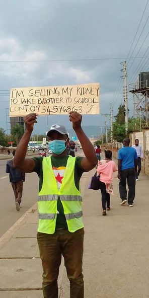 Desperate Kenyan Man takes placard selling his kidney to fund-raise brother’s varsity tuition