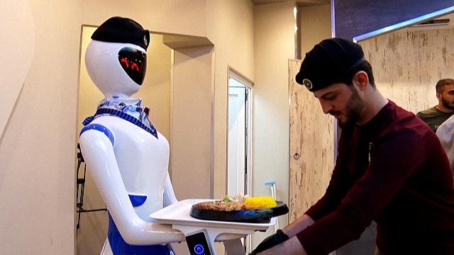 Robot waiters take Iraqis in Mosul into the future