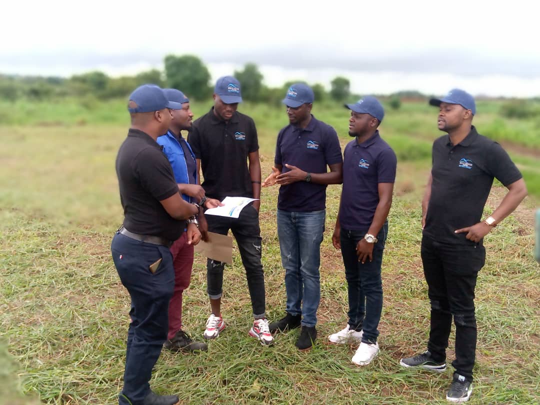 Hills & Associates hands over plots to two Malawi’s Flames players