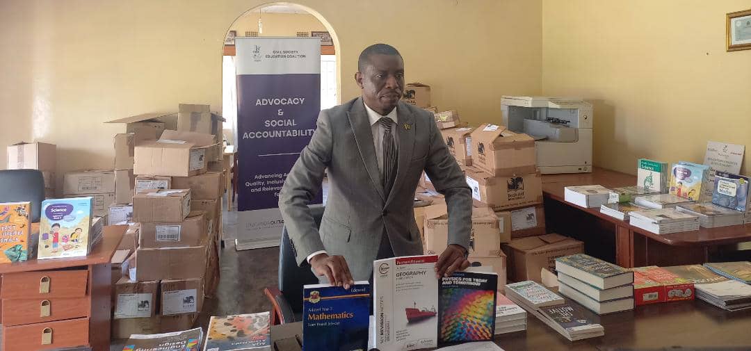 Kondowe displaying the some of the books