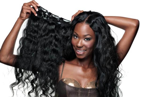 How do women get human hair used in wigs?