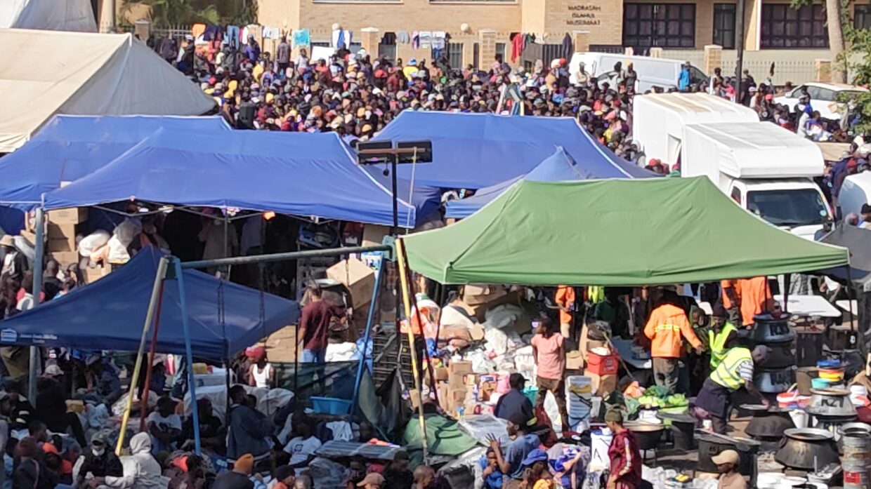 Police fire stun grenades as tensions flare at Durban refugee hall housing Malawian nationals